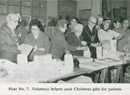 Voluntary helpers pack Christmas gifts for patients