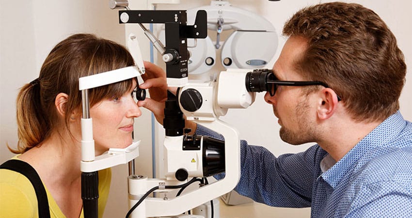 woman having an eye test woman having an eye test